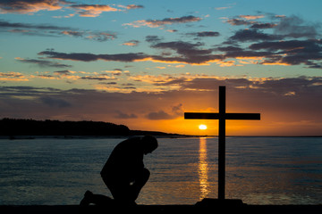 Kneeling Before The Cross