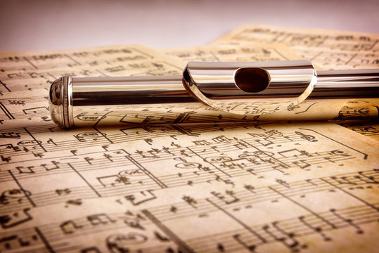 Mouthpiece of flute old handwritten sheet music front view