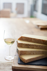 a glass of wine and cheese