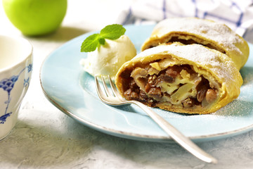 Apple strudel with raisins and walnuts.