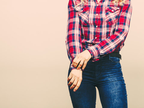 Female Body In Denim Pants Plaid Shirt