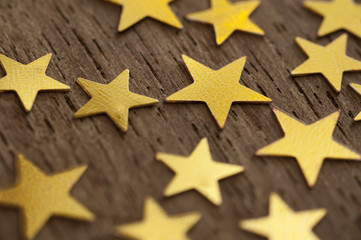 Golden stars scattered on a surface