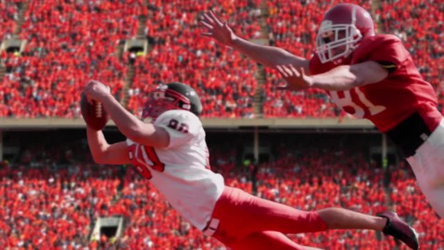 Football catch, slow motion, a football player catches a football in a stadium, 