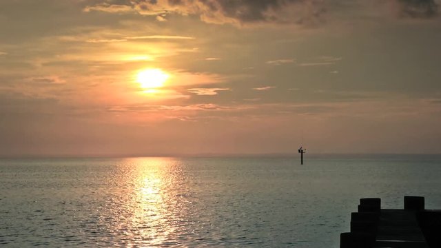 Time lapse sunset over ocean, Barnegat Bay, Beach Haven, NJ.