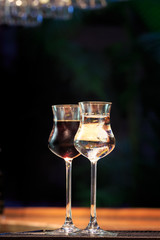 Jagermeister and sambuca on the bar stand. Concept of digestive