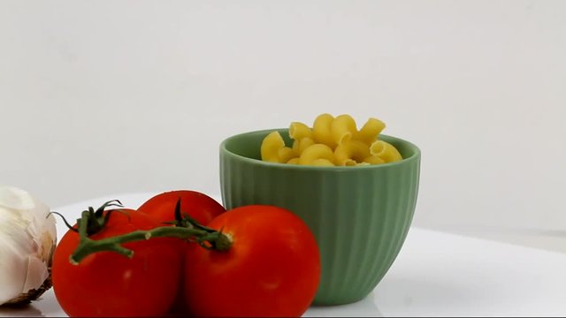 Cavatappi Pasta in a bowl with tomatoes and garlic