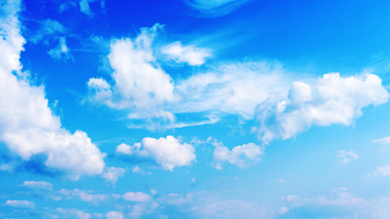 Naklejka na ściany i meble Blue sky and beautiful white clouds. Closeup. 