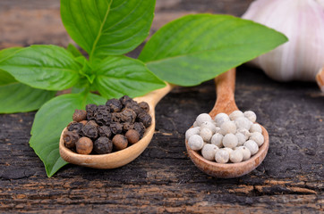 Sweet Basil , White with black pepper on wood spoon,wooden backg
