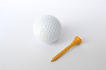 golf ball and wooden golf tees on white background, sport time