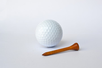 golf ball and wooden golf tees on white background, sport time