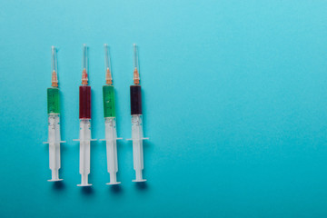 syringe on blue background.
