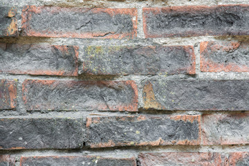 Old, crumbly and burnt bricks wall. Background.