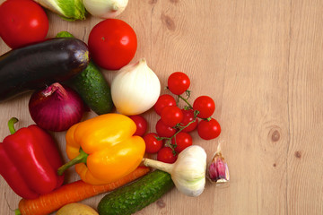 Fototapeta na wymiar Pile of organic vegetables on a wooden table