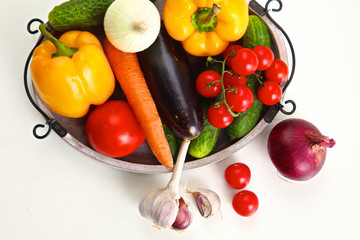 Pile of organic vegetables on a rustic wooden table