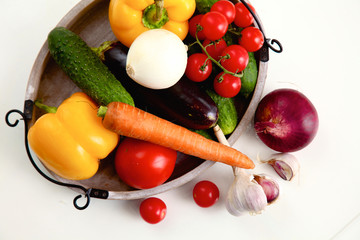 Composition with assorted raw organic vegetables wooden table