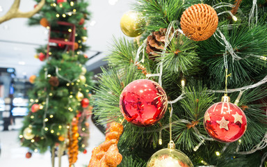 Fototapeta premium Decorated Christmas tree on blurred background. End of year celebration.