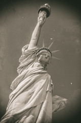 Statue of Liberty in front of blue sky, Liberty Island, New York City, USA, Old style image © AR Pictures