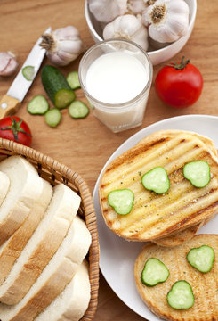 baked bread, milk and vegetables for breakfast