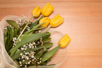 Yellow Tulips Bouquet Flowers Isolated On Wooden Background
