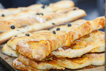 Chiabatta with olives lying on the counter for confectionery sho