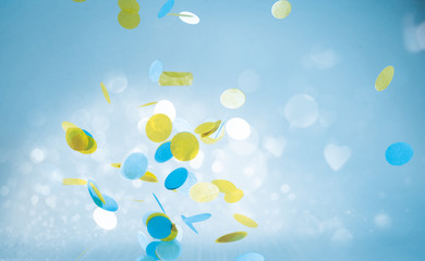Colorful yellow and blue shapes in blue sky