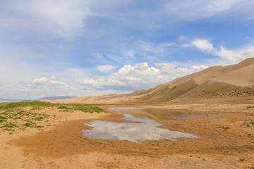 Fototapeta na wymiar Clouds over the Gobi desert, dune Hongoryn, Mongolia