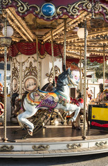 Carousel with horse in amusement park.