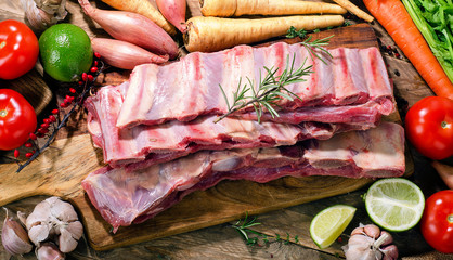 Raw fresh beef ribs with vegetables