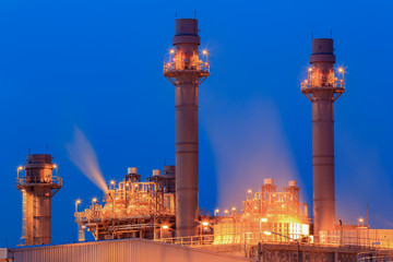 Fototapeta na wymiar Tower of Gas Combined Cycle Electric Power Plant with Blue Hour