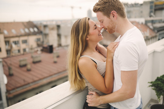 Sensual couple rooftop romance