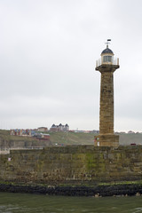 Lighthouse and stone pier
