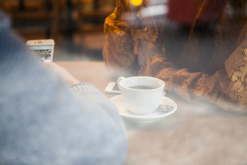 Glass through a window of a couple