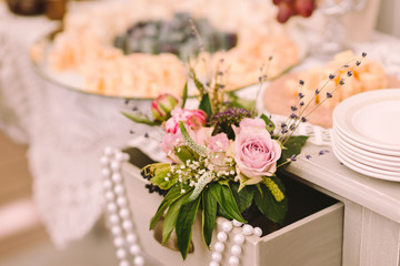 flower composition in a table drawer as a decoration of wedding