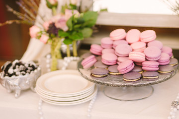 wedding candy bar with macaroni on the background of berries on