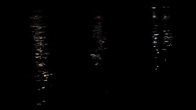 Water Reflection Texture and Ripples on a Black Background