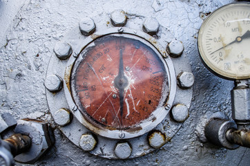 old pressure gauge on the pipeline / Water pressure transducer and pipe / Closeup of manometer / Pressure sensor / Pressure transmitter in oil and gas process / Electronic transducer