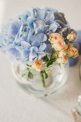 closeup of a floral composition on the table at wedding reception