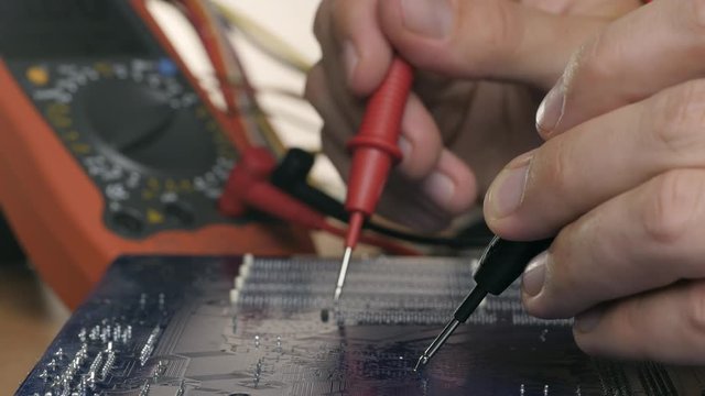 Technician repair motherboard. Technological background

