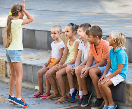 Portrait Of  Children Spending Time Outside And Playing Charades