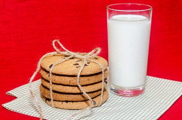 stack of cookies with rope connected glass milk