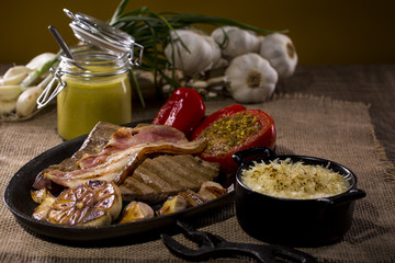 Dish with rustic snacks on rough canvas