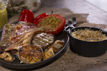 Dish with rustic snacks on rough canvas