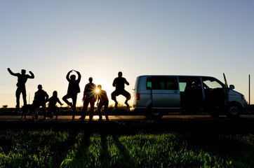 friends having fun on the side of the road