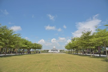 white building  behind a garden
