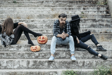 halloween man and girls with pumpkin