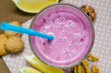 cups homemade smoothies with straws. Useful food fresh raw foods.