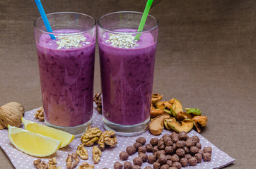 cups homemade smoothies with straws. Useful food fresh raw foods.