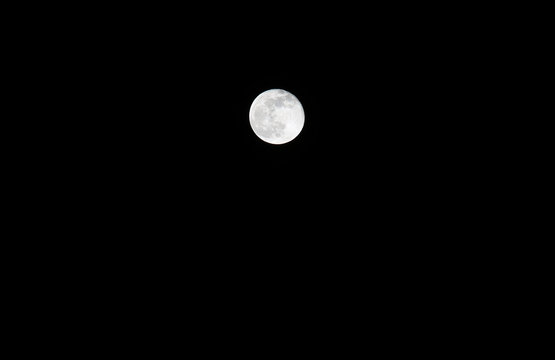 white magic full moon on a dark night