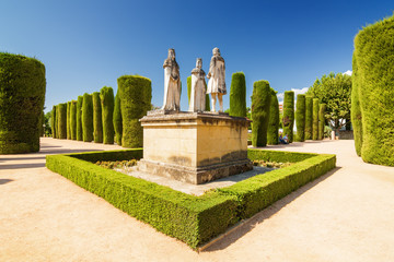 Statue of Christopher Columbus standing in front of King Ferdinand and Queen Isabella in the...