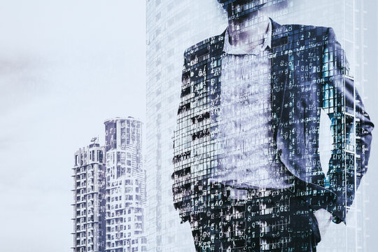 Digital business revolution concept. Double exposure of business man standing and abstract digital coding on building. Blue tone.